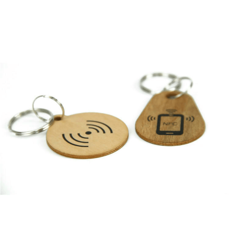 يُعرض حاملات مفاتيح RFID خشبية متعددة التردد للدخول مع التركيز على التحكم الآمن في الوصول لمشروعات ميداليات مفاتيح RFID خشبية.